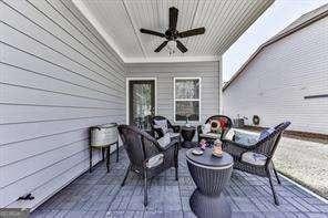 view of patio / terrace featuring ceiling fan