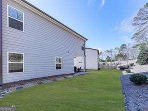 view of side of property featuring a lawn