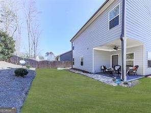 exterior space with a lawn, a patio, and ceiling fan