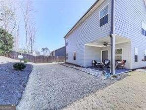 view of property exterior with a patio and ceiling fan