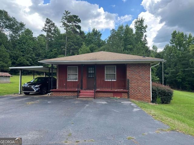 view of front of house featuring a front yard and covered porch