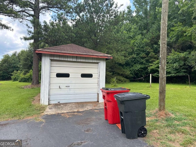 garage featuring a yard