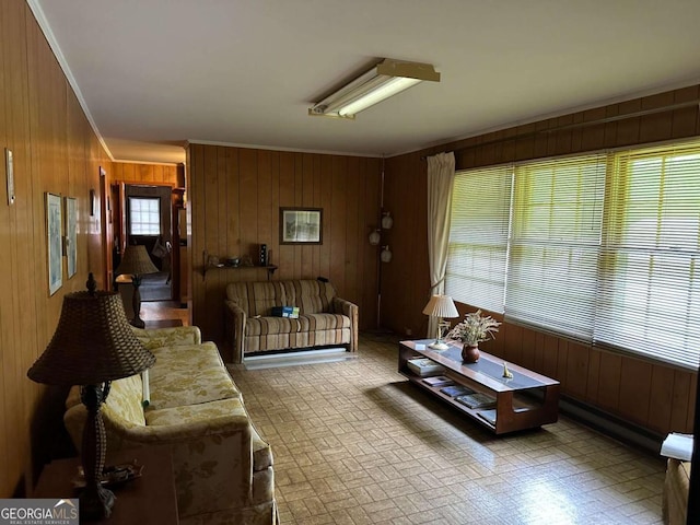 living room with crown molding and wooden walls