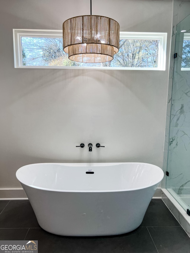 bathroom with tile patterned floors and separate shower and tub