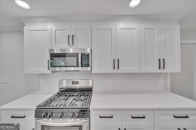 kitchen with white cabinetry and appliances with stainless steel finishes