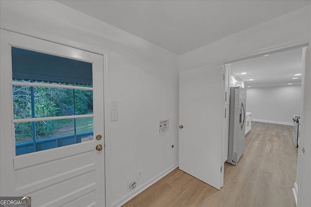 doorway with light wood-type flooring