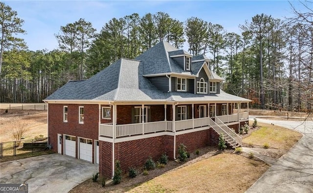 view of front facade with a garage and covered porch