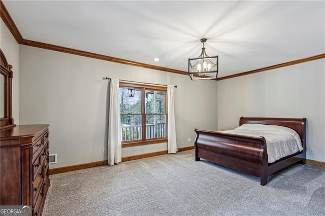 carpeted bedroom featuring crown molding and an inviting chandelier