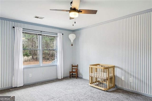 unfurnished room featuring carpet floors and ceiling fan