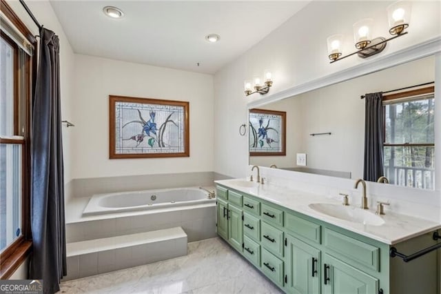 bathroom featuring vanity and tiled bath