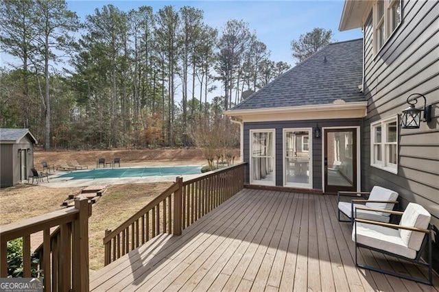 wooden deck with a covered pool