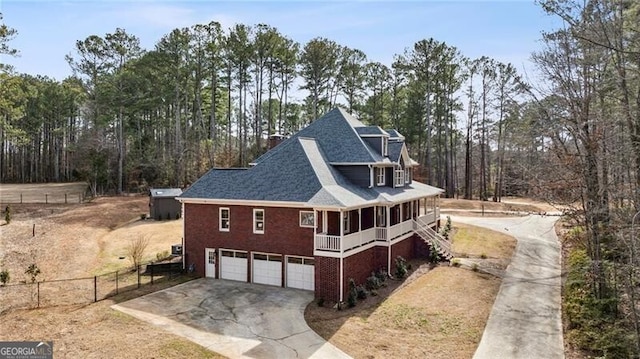 view of property exterior featuring a garage and a porch