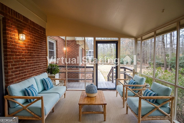 sunroom featuring vaulted ceiling