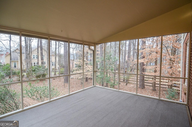 unfurnished sunroom with vaulted ceiling