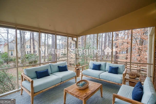 sunroom featuring lofted ceiling