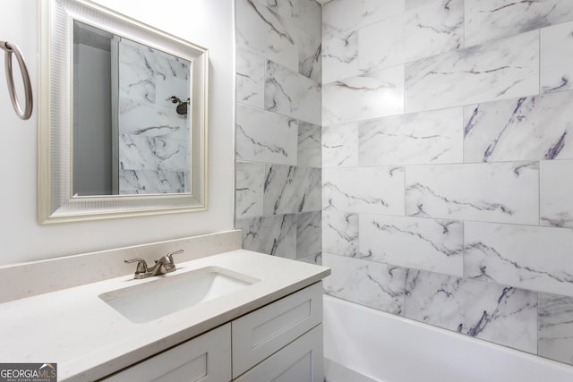 bathroom featuring shower / bathing tub combination and vanity