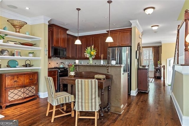 kitchen featuring pendant lighting, ornamental molding, black appliances, dark hardwood / wood-style flooring, and dark stone counters