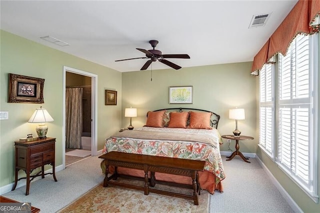 carpeted bedroom with multiple windows and ceiling fan