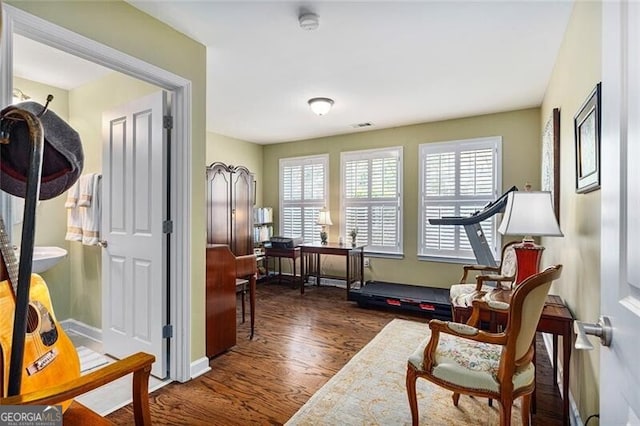 living area with dark hardwood / wood-style floors