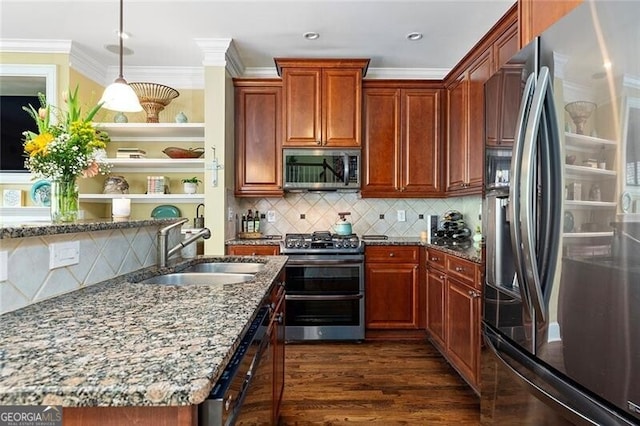 kitchen with appliances with stainless steel finishes, pendant lighting, sink, light stone counters, and dark wood-type flooring