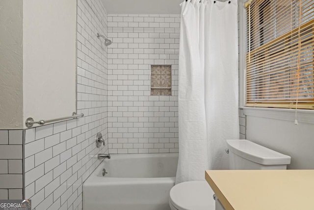 full bathroom featuring shower / tub combo with curtain, vanity, toilet, and tile walls