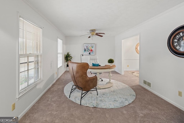 living area featuring light carpet, crown molding, and ceiling fan