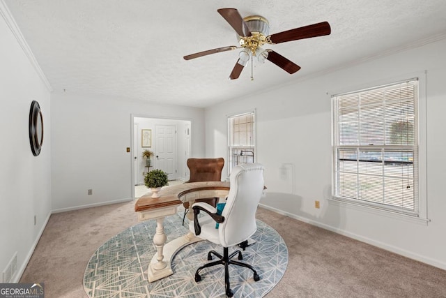 home office with ceiling fan, crown molding, light colored carpet, and a textured ceiling