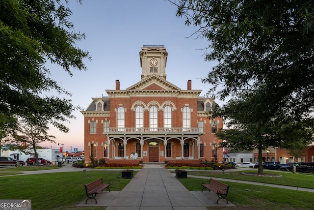 view of outdoor building at dusk