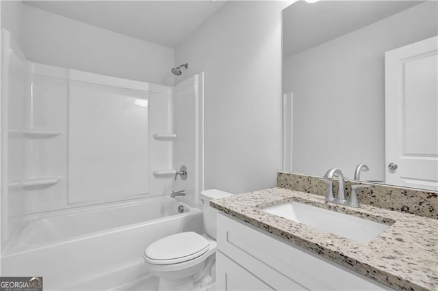 full bathroom with vanity, toilet, and  shower combination