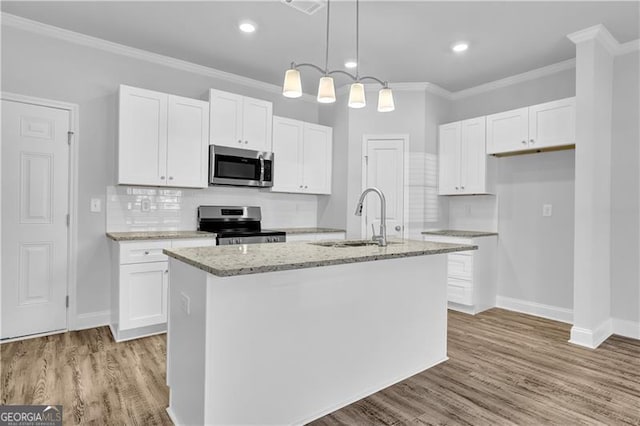 kitchen featuring white cabinetry, sink, an island with sink, and appliances with stainless steel finishes