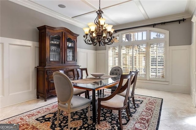 dining room with ornamental molding, a chandelier, and light tile patterned floors