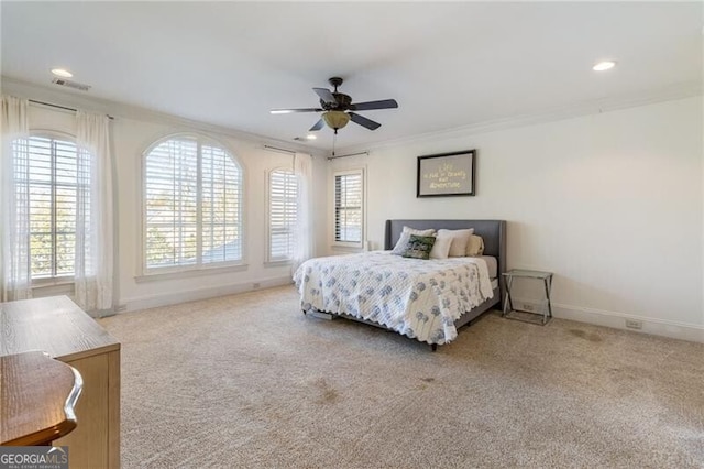 bedroom with light carpet, ornamental molding, and ceiling fan