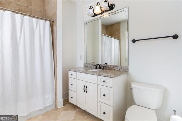 bathroom with vanity, toilet, and a shower with shower curtain