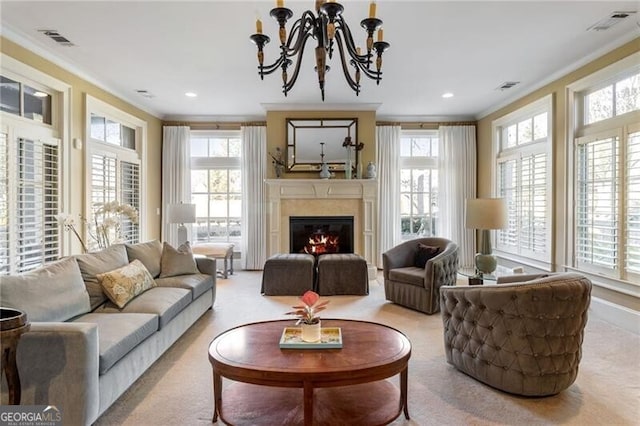 living room with crown molding, a wealth of natural light, and an inviting chandelier