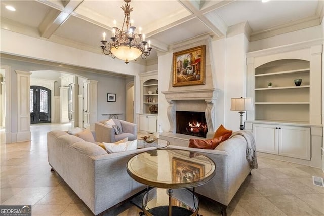 living room featuring built in shelves, coffered ceiling, ornate columns, ornamental molding, and beamed ceiling