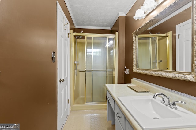 bathroom featuring vanity, crown molding, a shower with door, and a textured ceiling