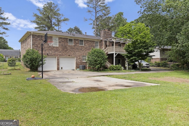 view of front facade with a wooden deck, a garage, a front lawn, and central air condition unit