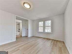 spare room with light hardwood / wood-style floors