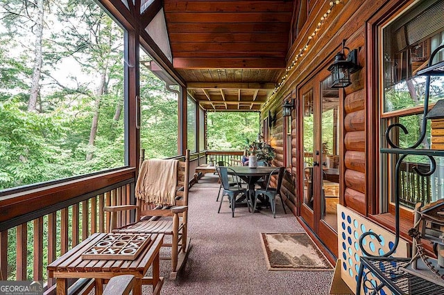 sunroom / solarium featuring wood ceiling