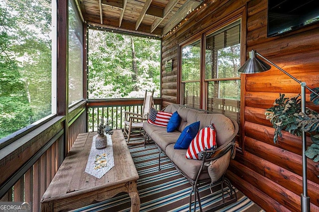 wooden terrace featuring an outdoor hangout area