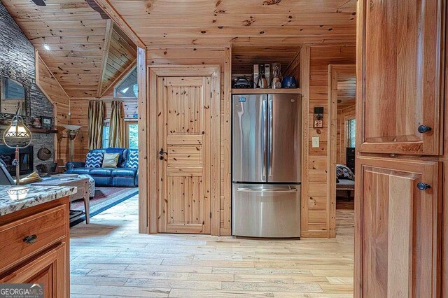 bedroom featuring wood-type flooring, wooden walls, ceiling fan, and wood ceiling