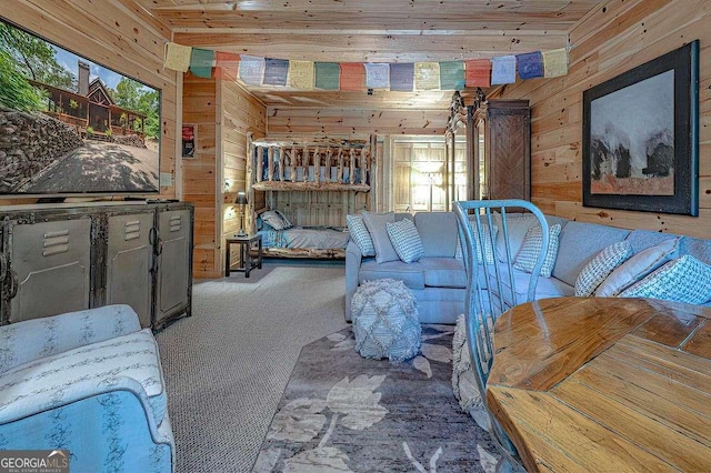 bedroom featuring wood ceiling, carpet flooring, and wood walls