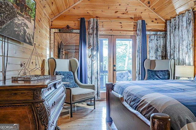 bedroom with wood ceiling, vaulted ceiling, wood walls, and access to outside