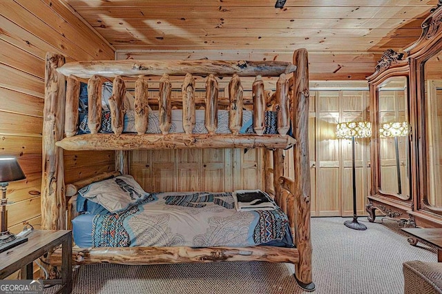 bedroom with wooden ceiling and carpet