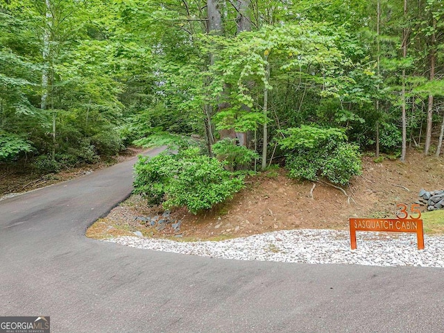 surrounding community with a view of trees