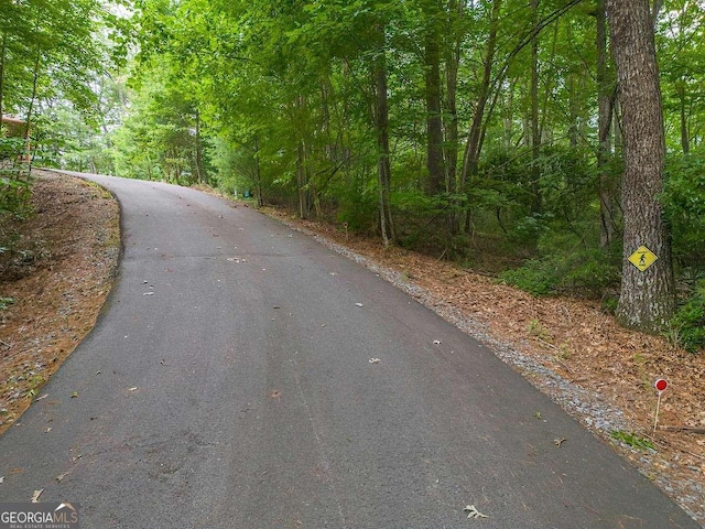 view of road with a view of trees