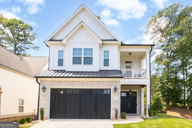 modern farmhouse with a garage, a balcony, and a front yard