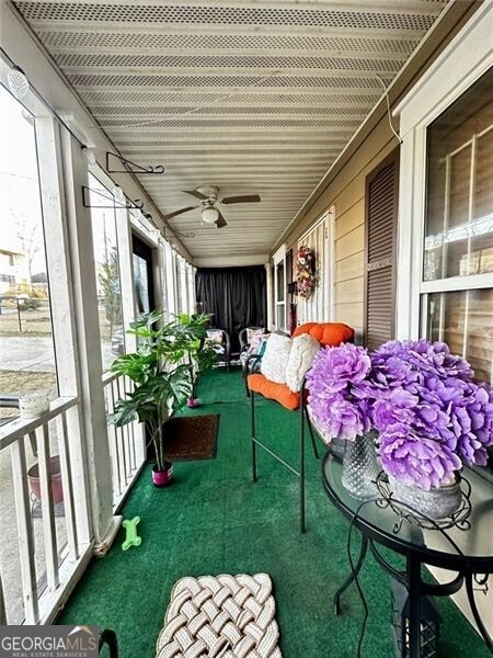 balcony featuring ceiling fan