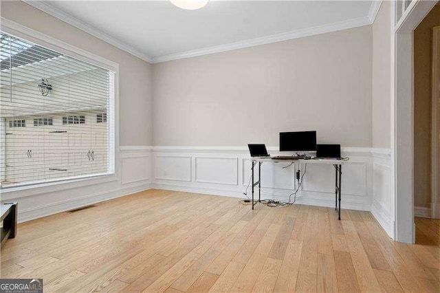 office featuring crown molding and light hardwood / wood-style flooring