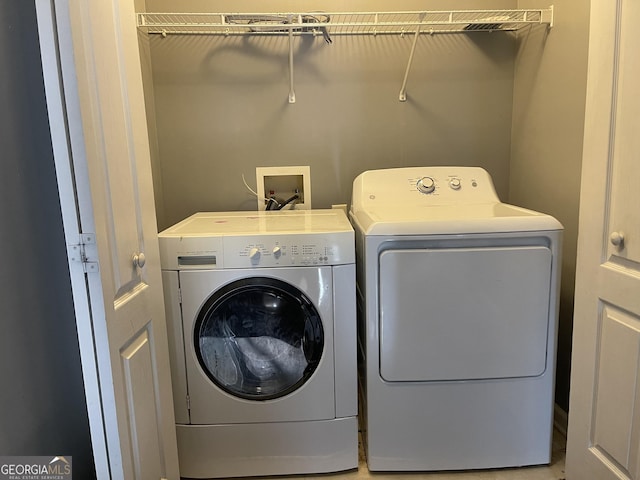 laundry room with washer and clothes dryer